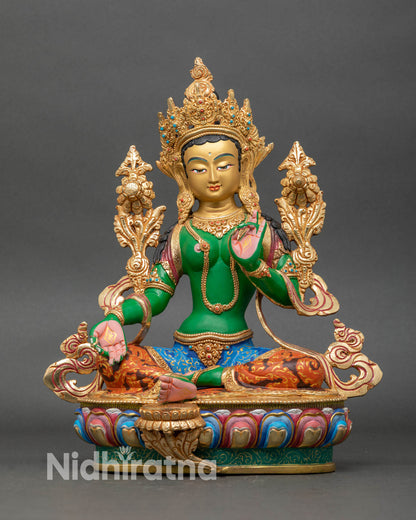 Front view of Green Tara statue handcrafted from copper with gold-painted face.