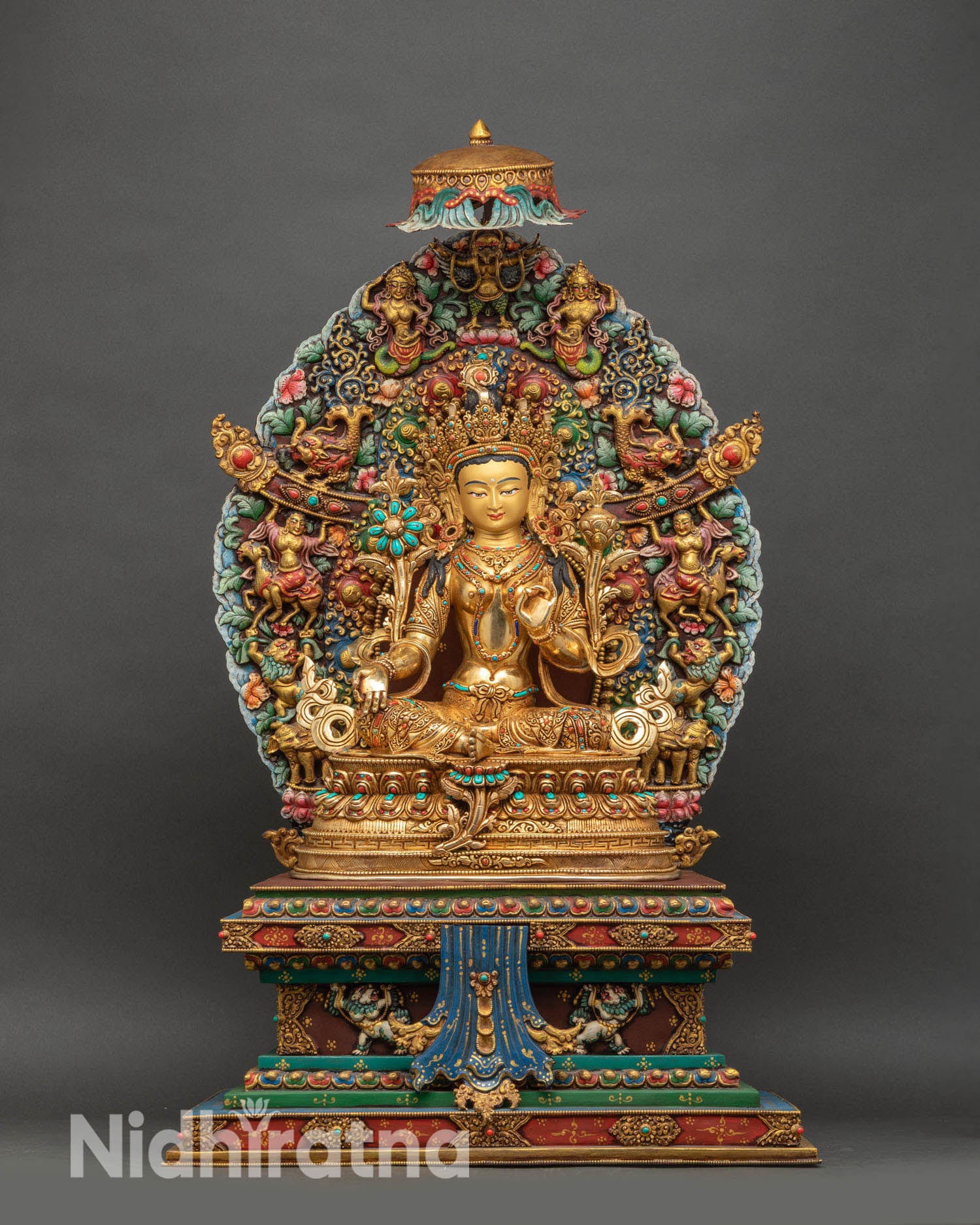 Front view of Green Tara statue handcrafted in copper with fire-gilded finish and semi-precious stones