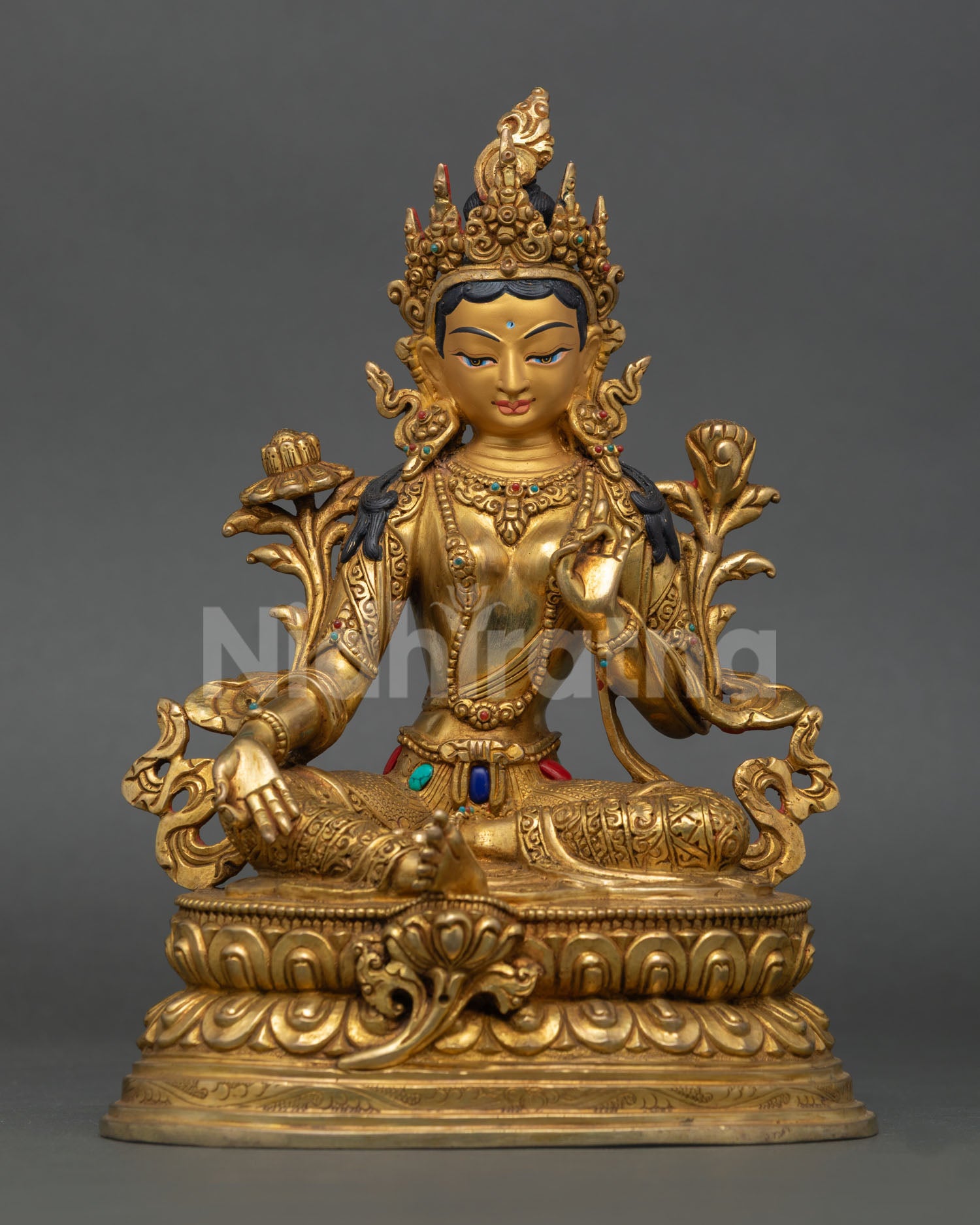 Front view of Green Tara Statue, handmade by a Newari artist from Patan, Nepal, copper, gold-painted face, double lotus pedestal