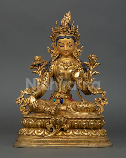 Front view of Green Tara Statue, handmade by a Newari artist from Patan, Nepal, copper, gold-painted face, double lotus pedestal