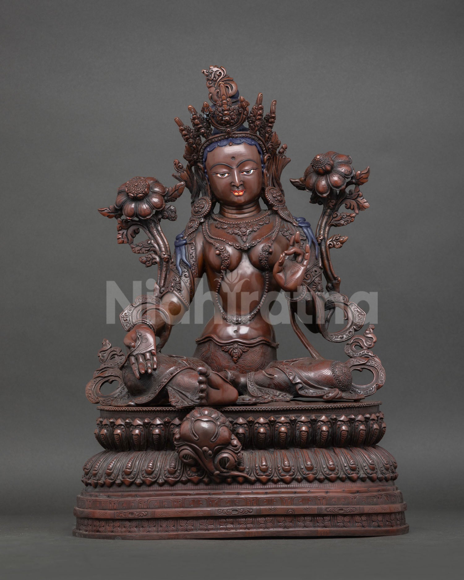 Front view of Green Tara statue, oxidized copper, seated on lotus pedestal, handmade Newari craftsmanship from Nepal