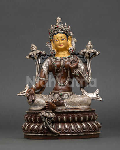 Front view of Green Tara statue oxidized copper silver plated details gold painted face double lotus throne Nepal craftsmanship