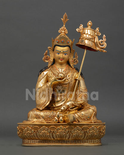 Front view of Guru Norlha statue in 24K gold fire gilded copper holding chintamani and jewel spitting mongoose