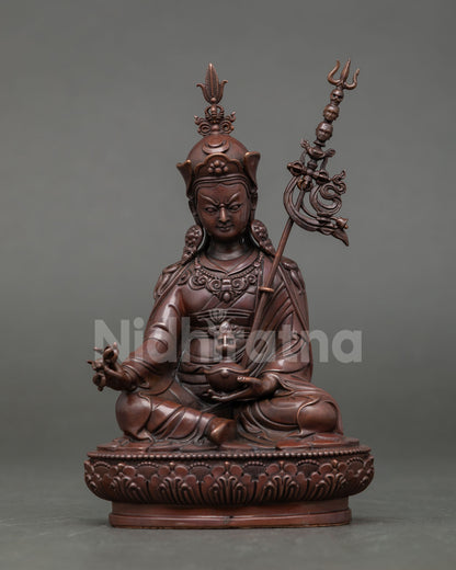 Front view of Guru Rinpoche statue handcrafted in oxidized copper with vajra and kalash Nepalese Buddhist altar decor