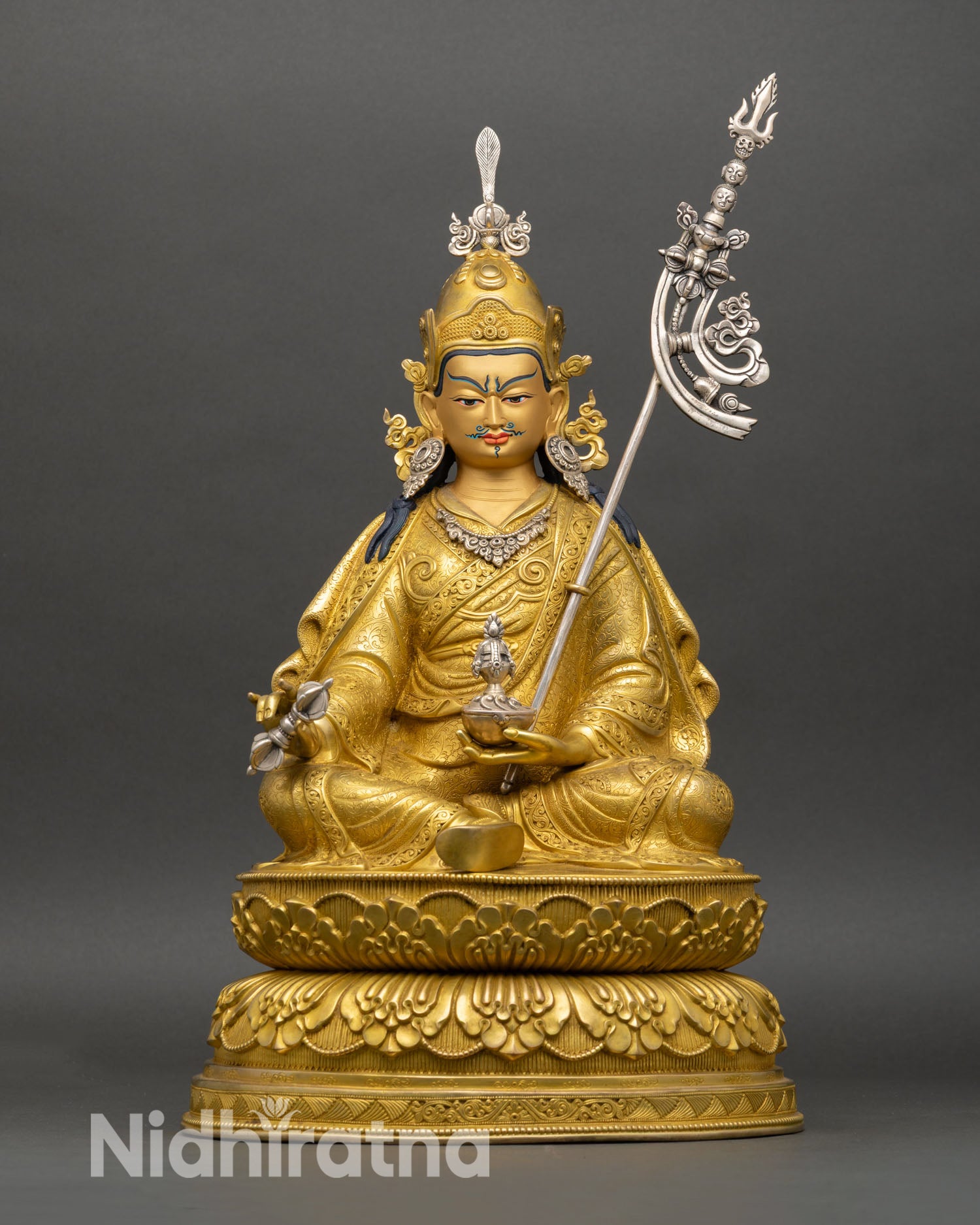 Front view of Guru Rinpoche statue seated on double lotus pedestal copper gold gilded finish vajra kalash