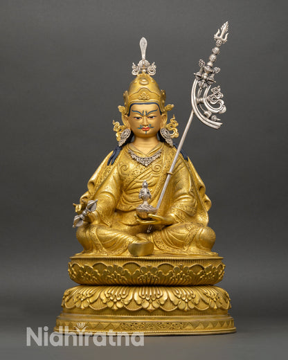 Front view of Guru Rinpoche statue seated on double lotus pedestal copper gold gilded finish vajra kalash
