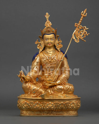 Front view of Guru Rinpoche statue with 24K gold gilding turquoise coral stone inlays and copper craftsmanship Nepal