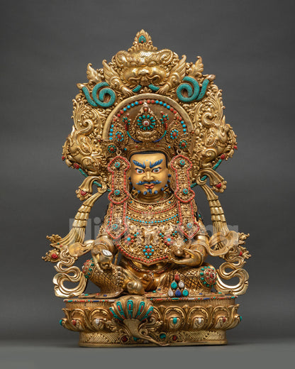 Front view of handcrafted Dzambhala statue copper with 24K gold gilding, jeweled diadem armor, Garuda halo, semi-precious stones, Nepal