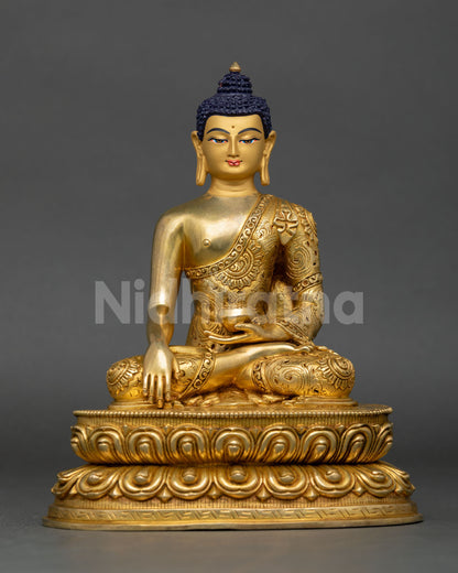 Front view of handcrafted Shakyamuni Buddha statue in gold detailed copper from Nepal