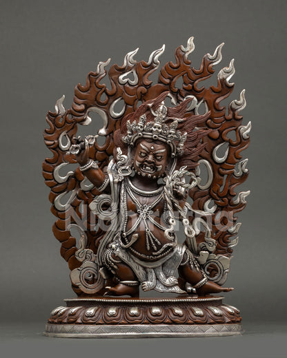 Front view of handcrafted Vajrapani statue copper oxidized finish silver plated detailing wrathful protector deity Nepal Newari artisan sculpture