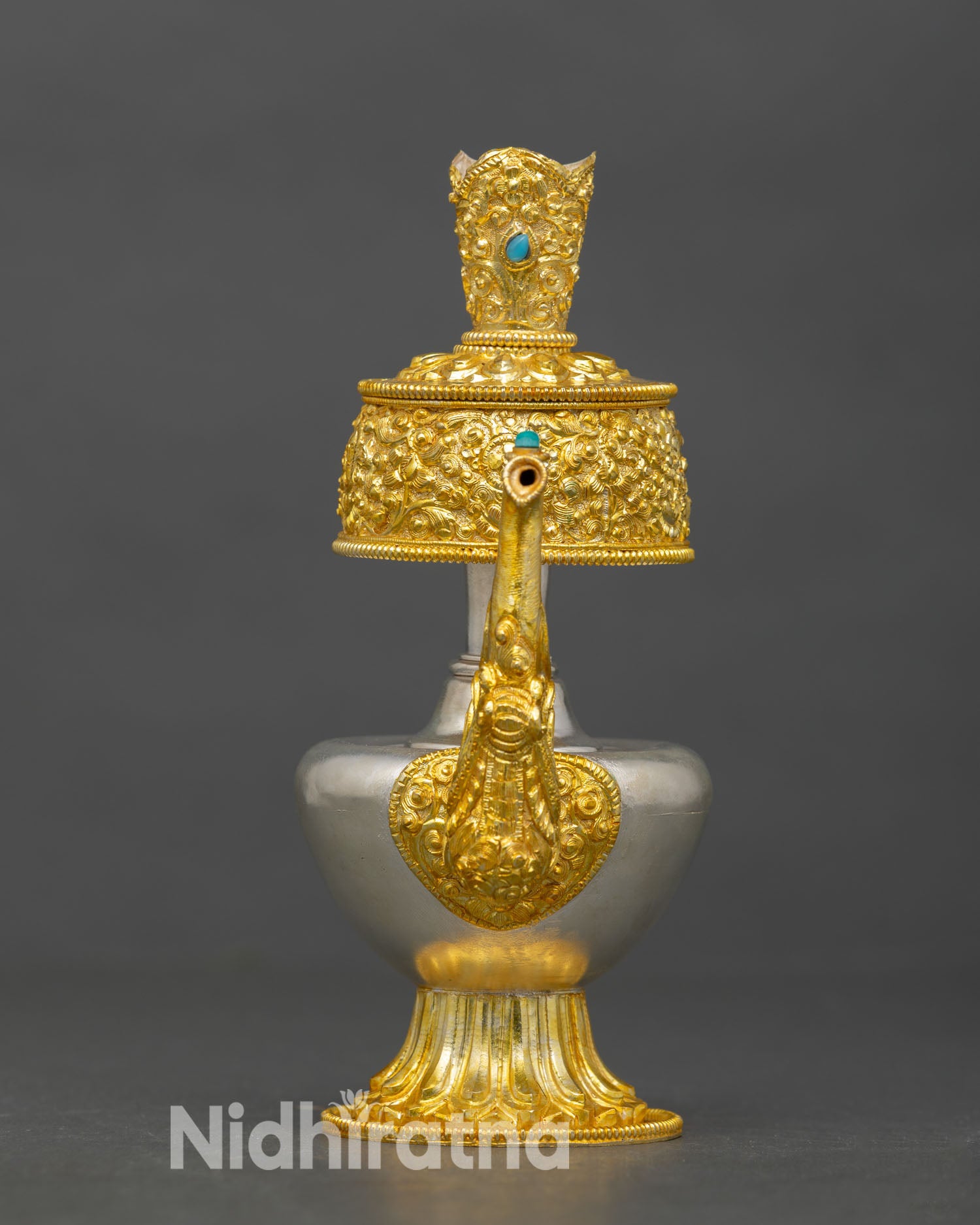 Front view of Himalayan Bhumba offering vase copper alloy silver and gold plated Buddhist ritual vessel Nepal