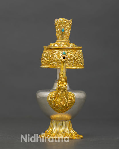 Front view of Himalayan Bhumba offering vase copper alloy silver and gold plated Buddhist ritual vessel Nepal