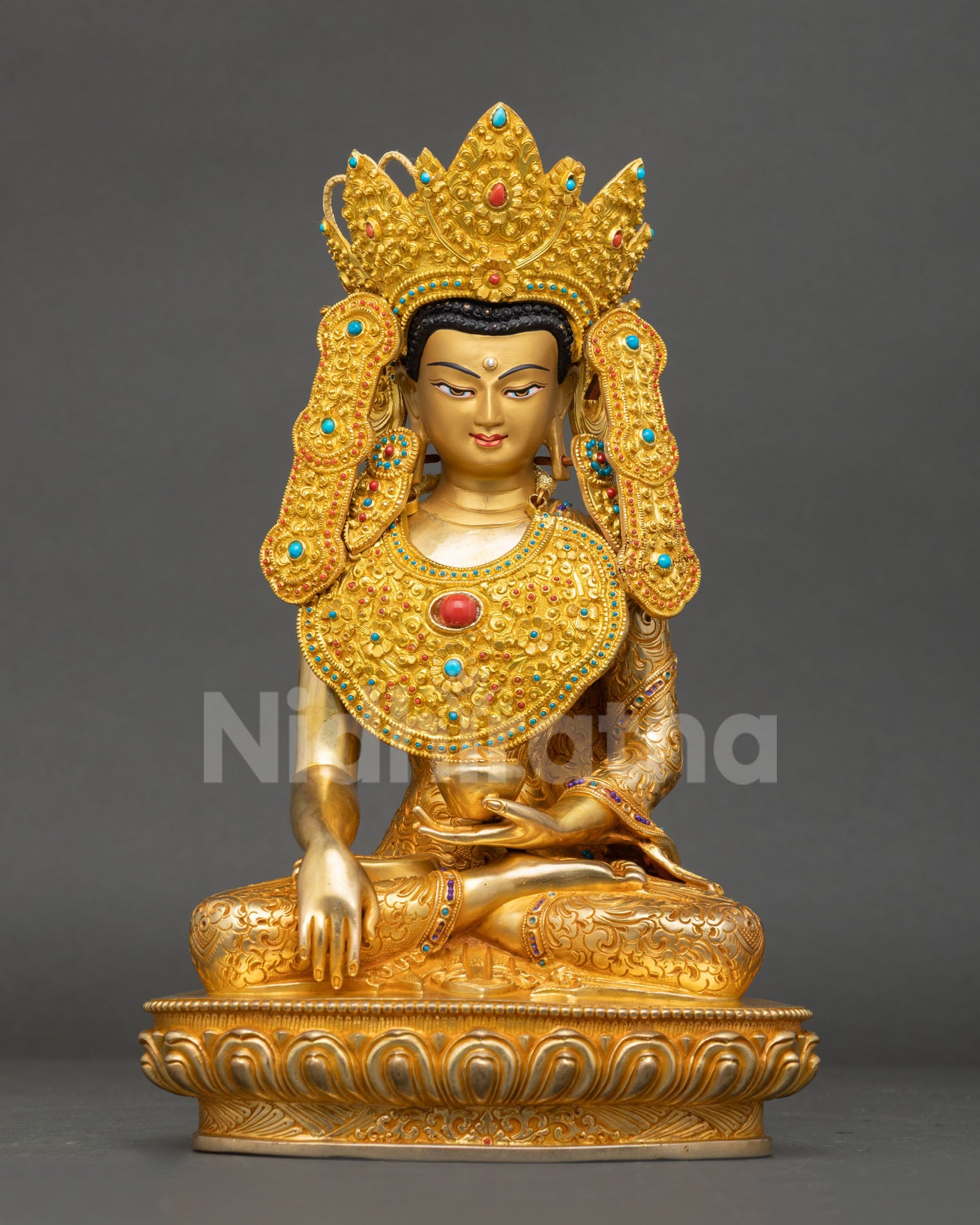Front view of Jowo Rinpoche Buddha statue, handcrafted in Nepal with copper gold fire gilding and hand painted face, seated on lotus pedestal