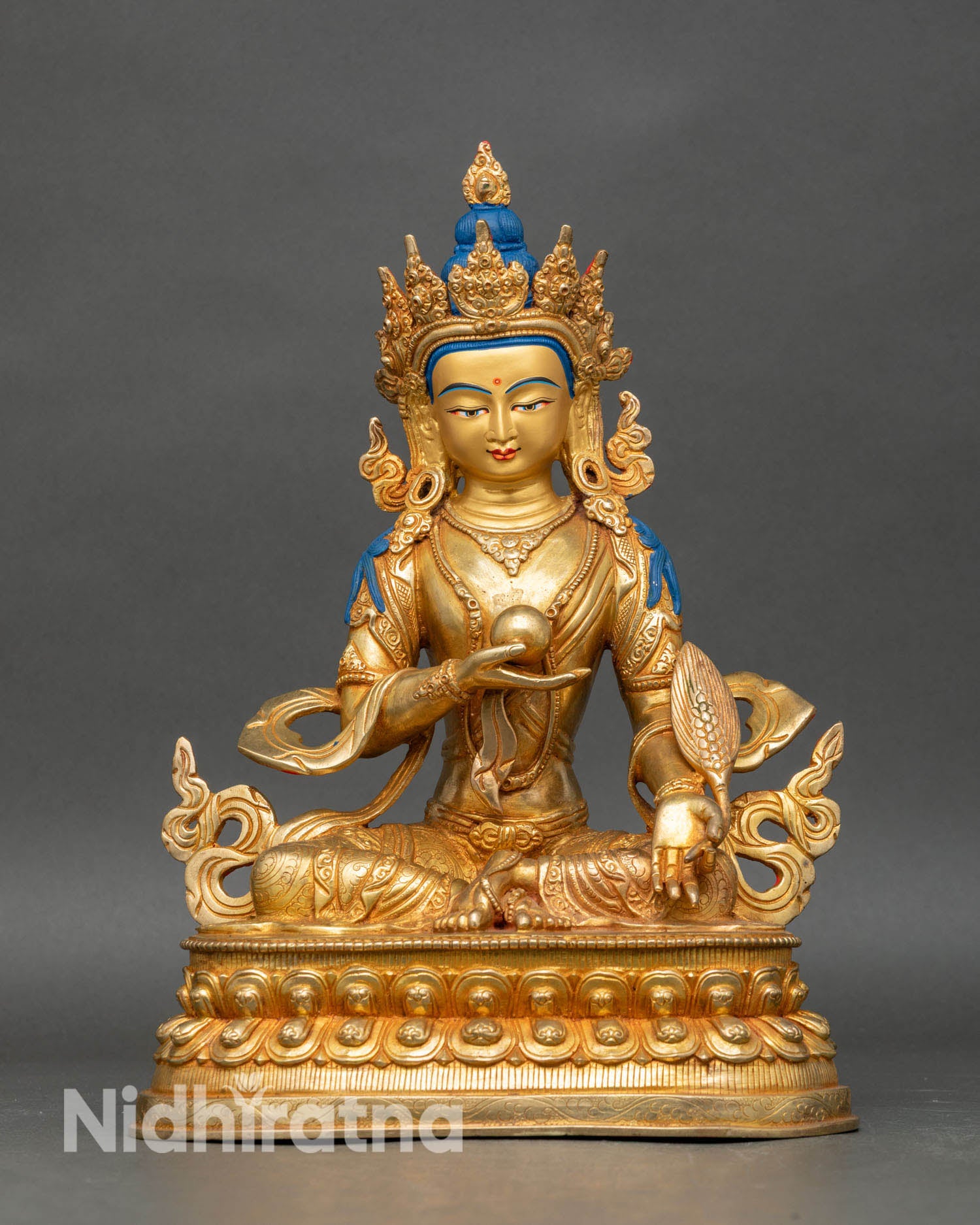 Front view Kshitigarbha statue seated on lotus, copper with gold gilding and turquoise coral stones.