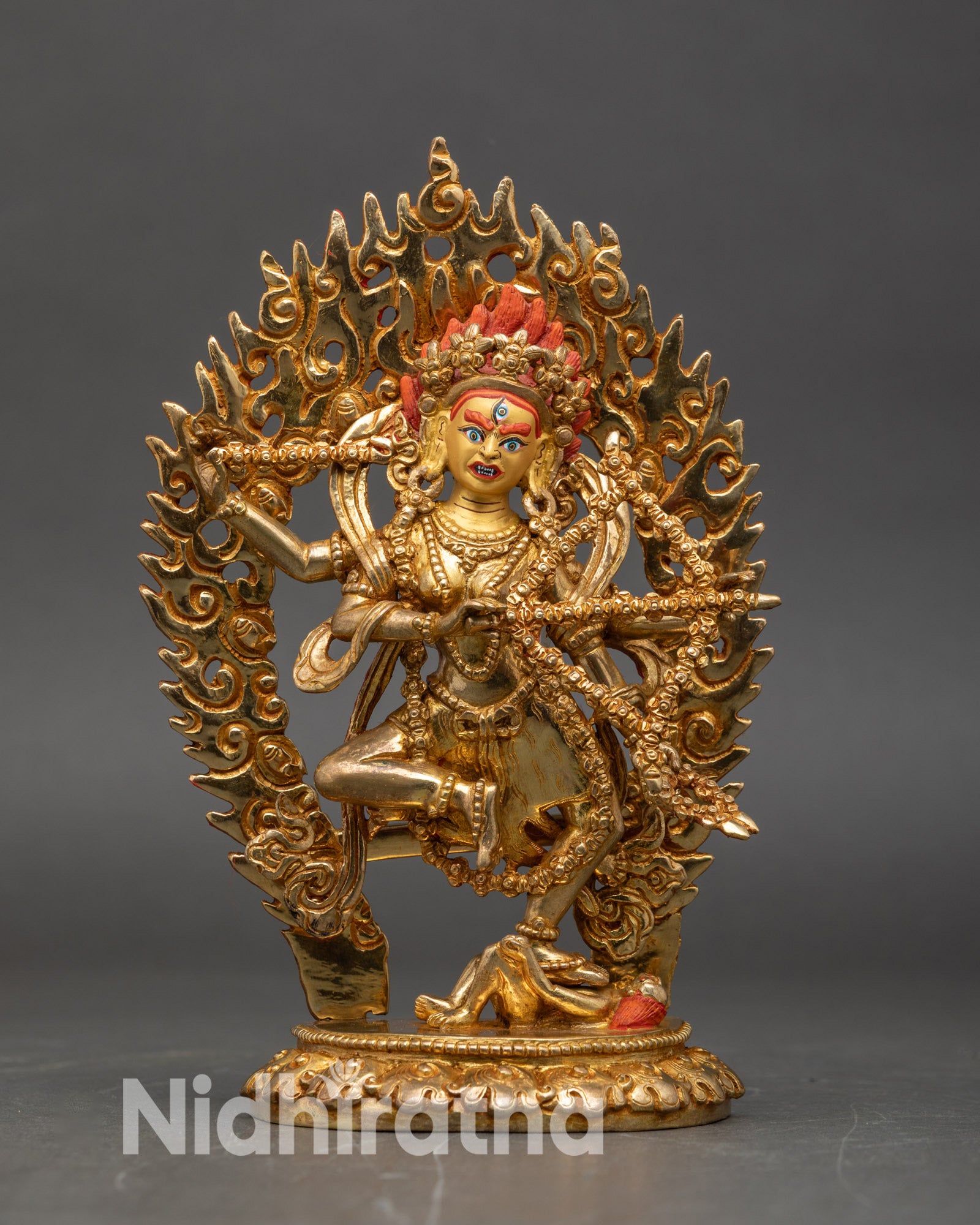 Front view Kurukulla statue gold gilded copper Tibetan tantric goddess lotus throne Nepal