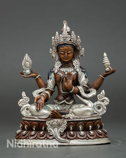 Front view of Laxmi statue silver plated oxidized copper goddess of wealth seated on lotus throne Patan Nepal