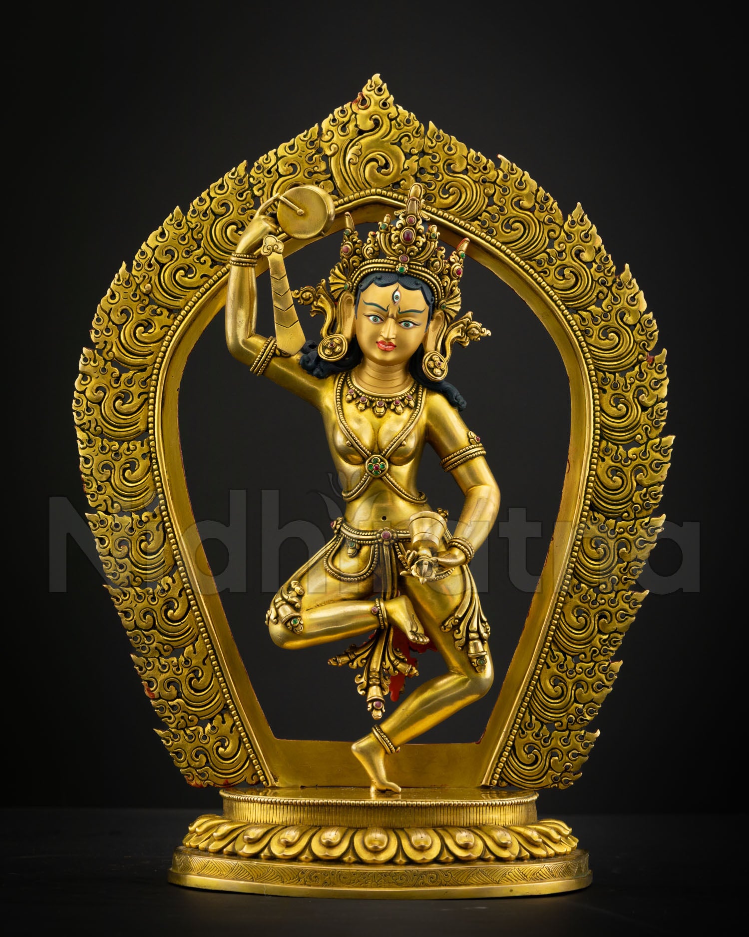 Front view Machig Labdron statue handcrafted in copper with radiant 24K gold gilding standing on lotus seat with semi precious stones for Buddhist altar decor