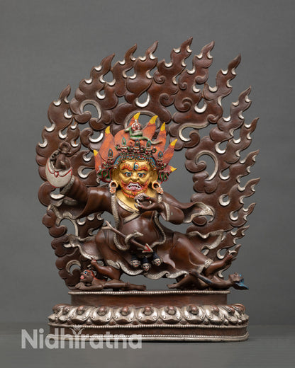 Front view of Mahakala Bernagchen statue handcrafted copper sculpture oxidized silver plated finish gold painted face wrathful protector deity