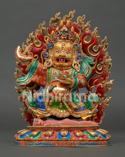 Front view of Mahakala Bernagchen statue handmade in copper with gold gilded finish and blazing halo holding sacred implements