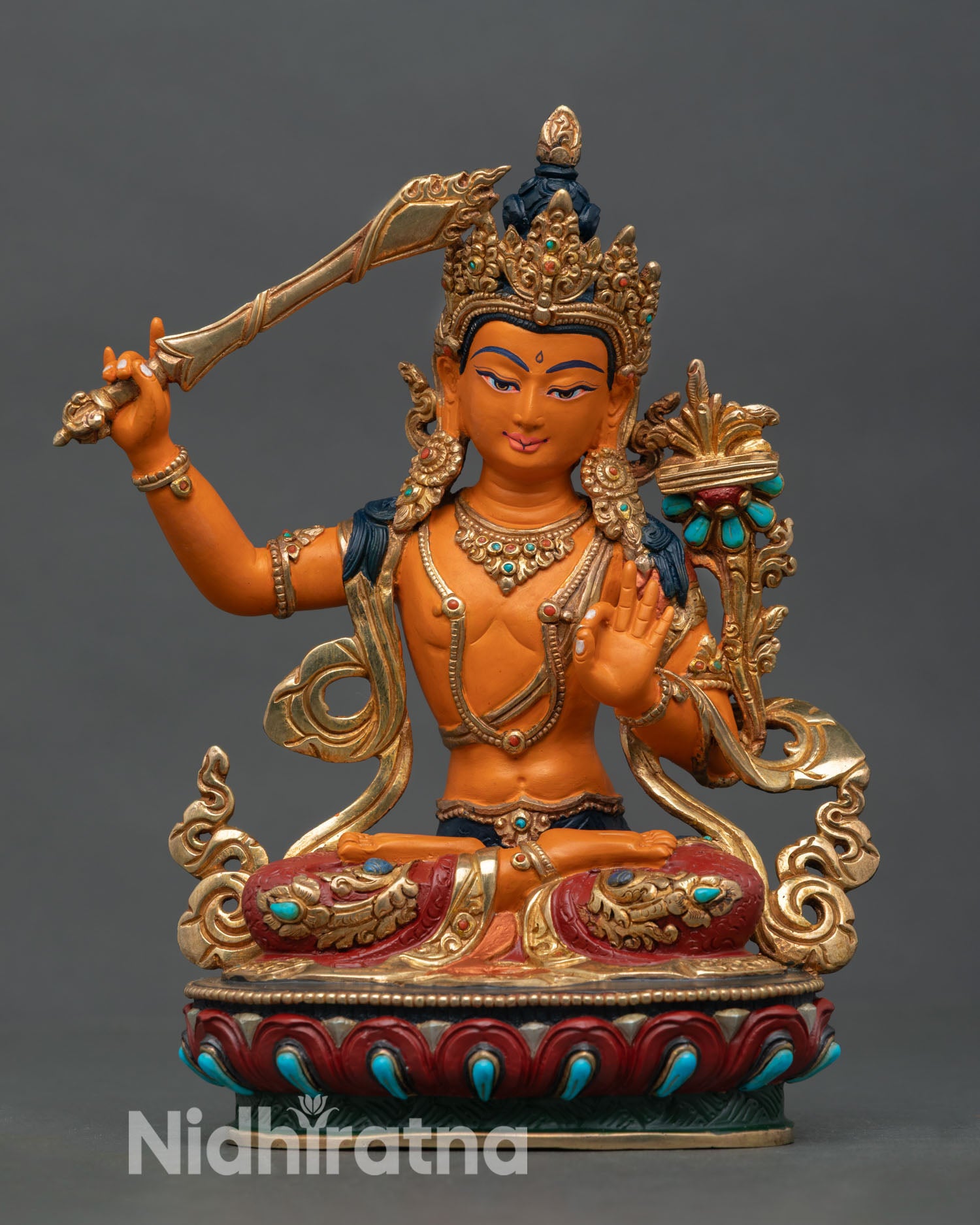 Front view of Manjushri statue copper Himalayan Buddhist sculpture lost wax casting gold gilded detailing lotus pedestal altar decor Nepal