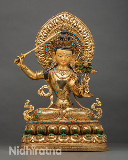 Front view of Manjushri statue, copper sculpture 24K gold fire gilding Kathmandu Valley handcrafted bodhisattva wisdom sword flaming Himalayan sacred art