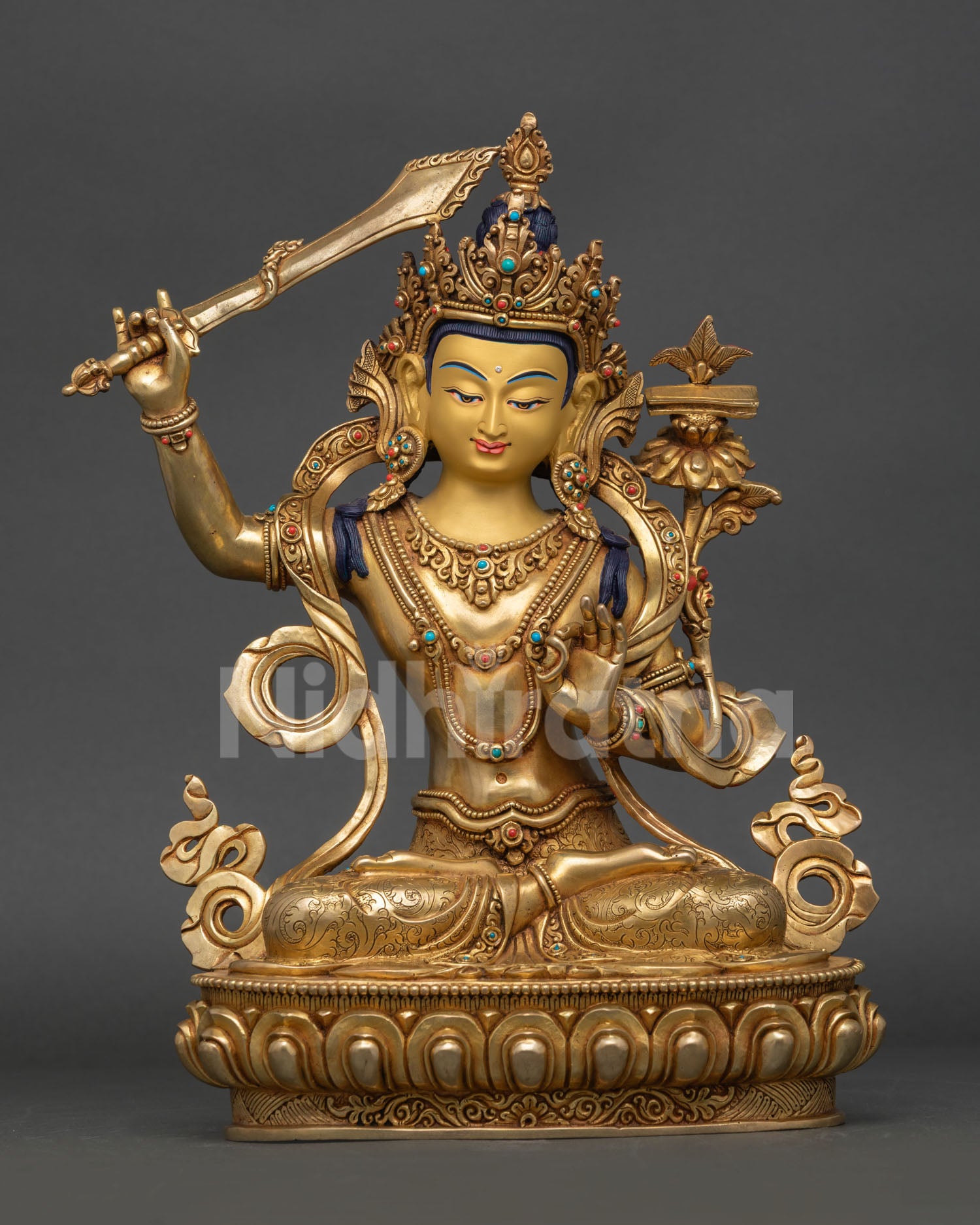 Front view of Manjushri Statue, fire-gilded copper Bodhisattva of Wisdom seated on a lotus throne