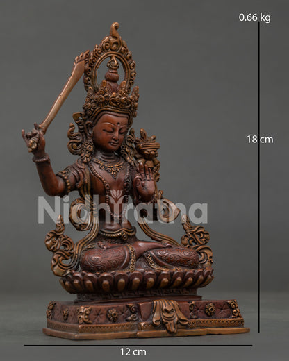 Front view Manjushri statue with flaming wisdom sword and lotus Prajnaparamita Sutra.