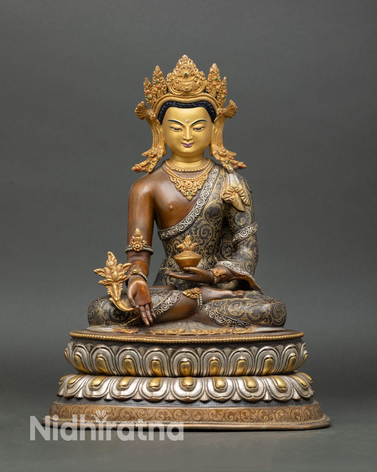 Front view of Medicine Buddha statue, copper oxidized finish, gold painted face, five jewel crown, semi precious stones, altar sculpture Nepal