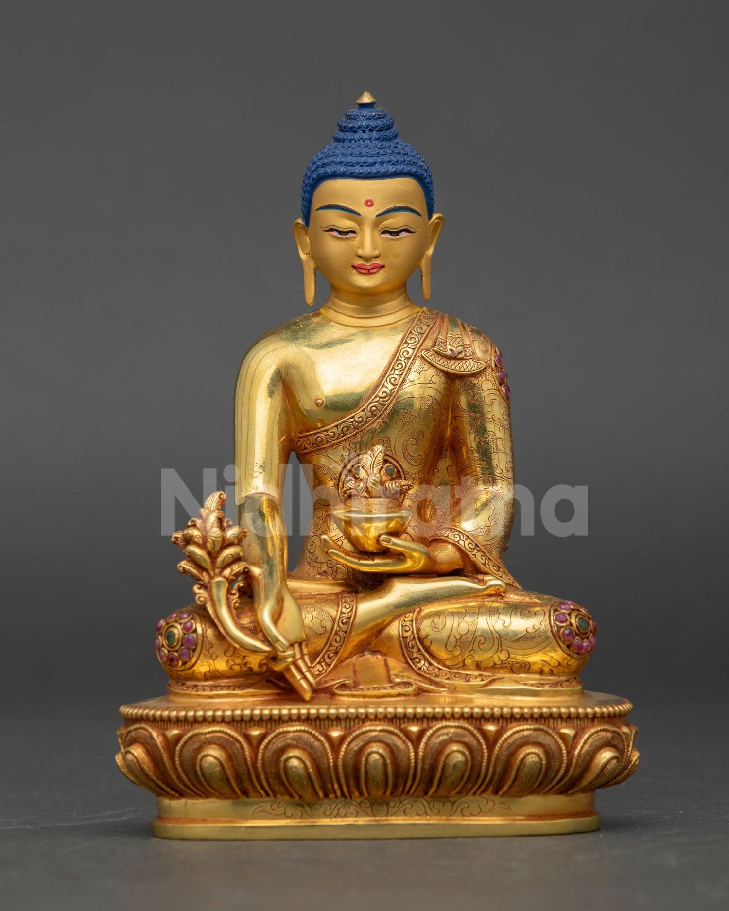 Front view of Medicine Buddha statue handcrafted in copper with 24k gold gilding semi precious stones and serene healing expression