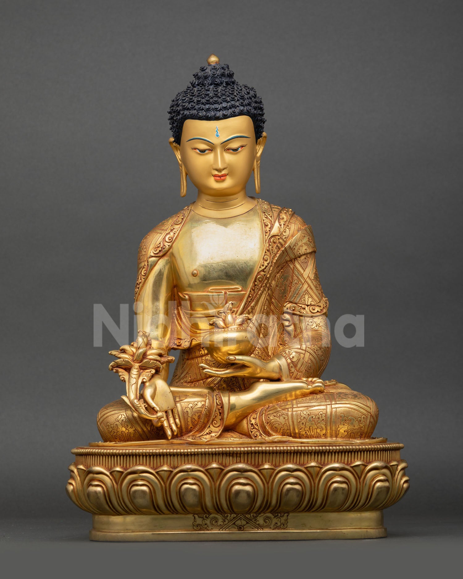Front view of Medicine Buddha statue handcrafted in Nepal with 24K gold gilding copper and healing altar decor