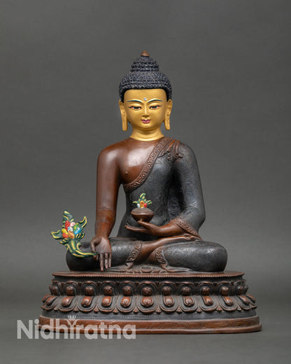 Front view of Medicine Buddha statue oxidized copper gold painted face, lost wax casting, Buddhist altar sculpture
