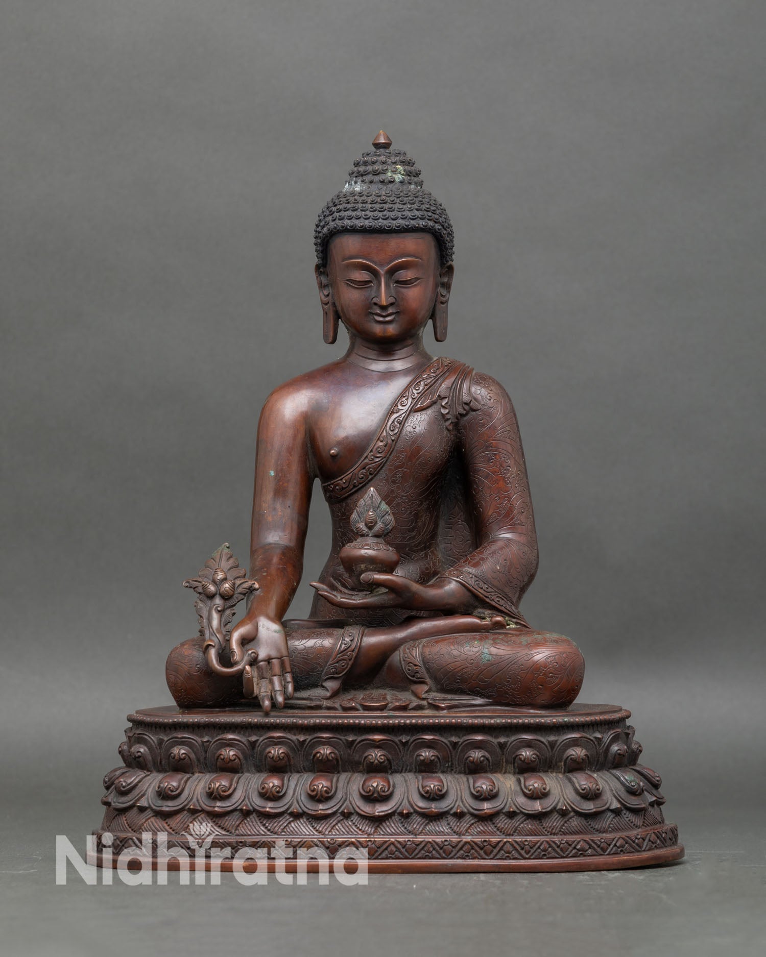 Front view Medicine Buddha statue with oxidized copper and double lotus throne