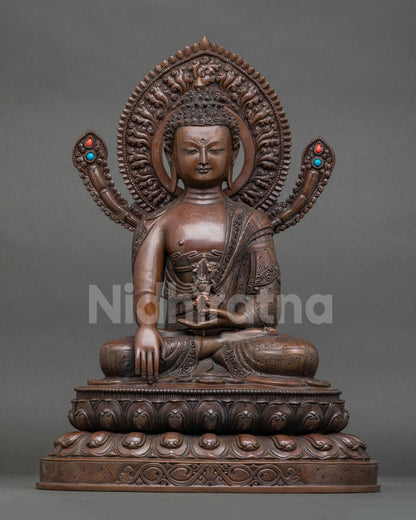 Front view of Mitrugpa Buddha statue in oxidized copper with lotus throne and vajra