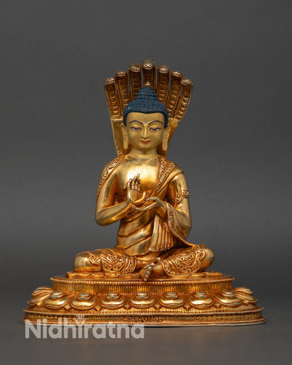 front view nagarjuna statue gold gilded mahasiddha lotus base buddhist philosopher nepal