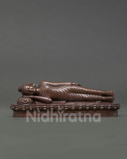 Front View of Nirvana Buddha Statue handcrafted in oxidized copper reclining Buddha sculpture symbolizing enlightenment and inner peace