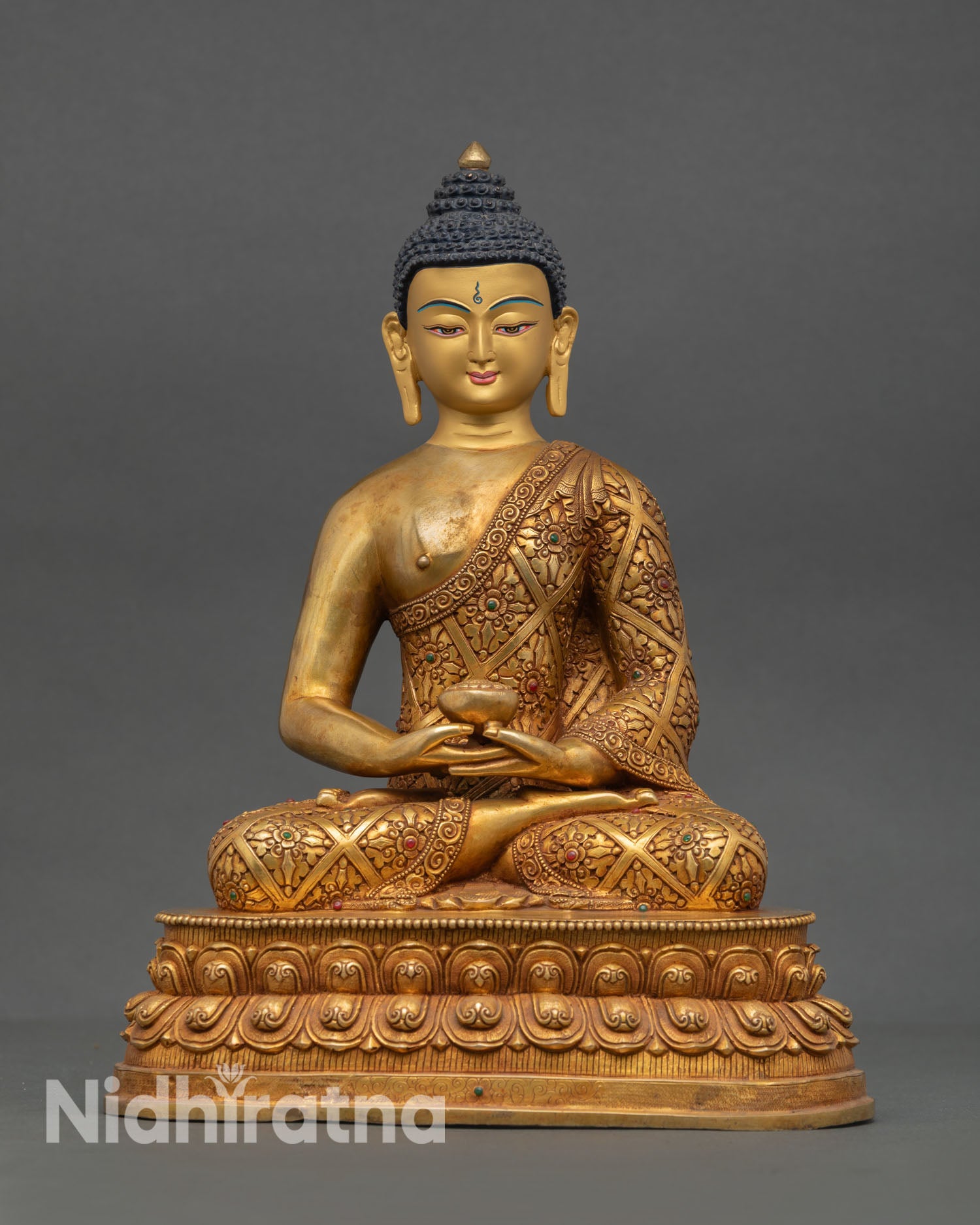 Front view of Amitabha Buddha statue handcrafted in Nepal with copper body fire gilded gold finish and lotus meditation throne