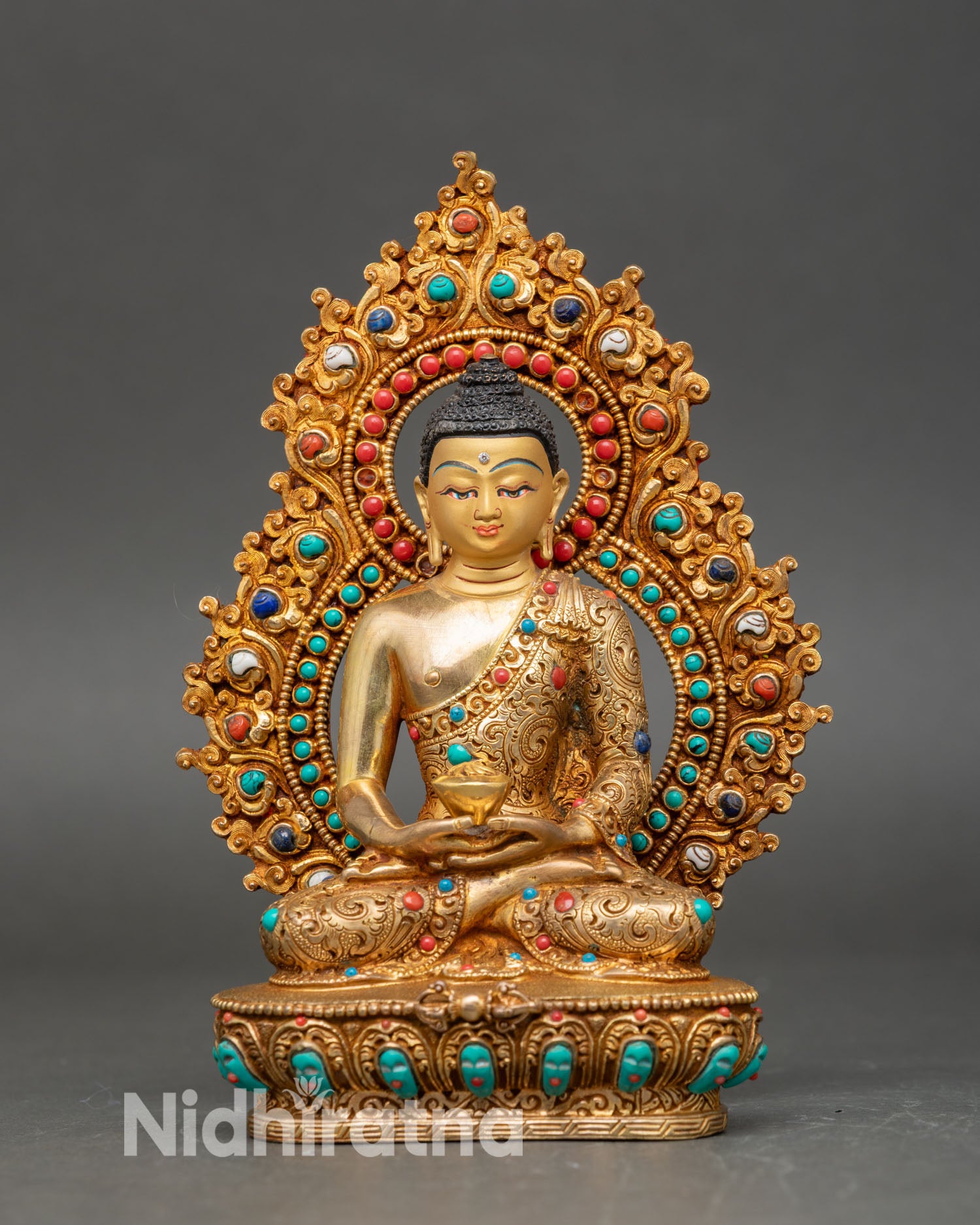 Front view of Amitabha Buddha statue, handmade from copper with gold finish on a lotus pedestal.