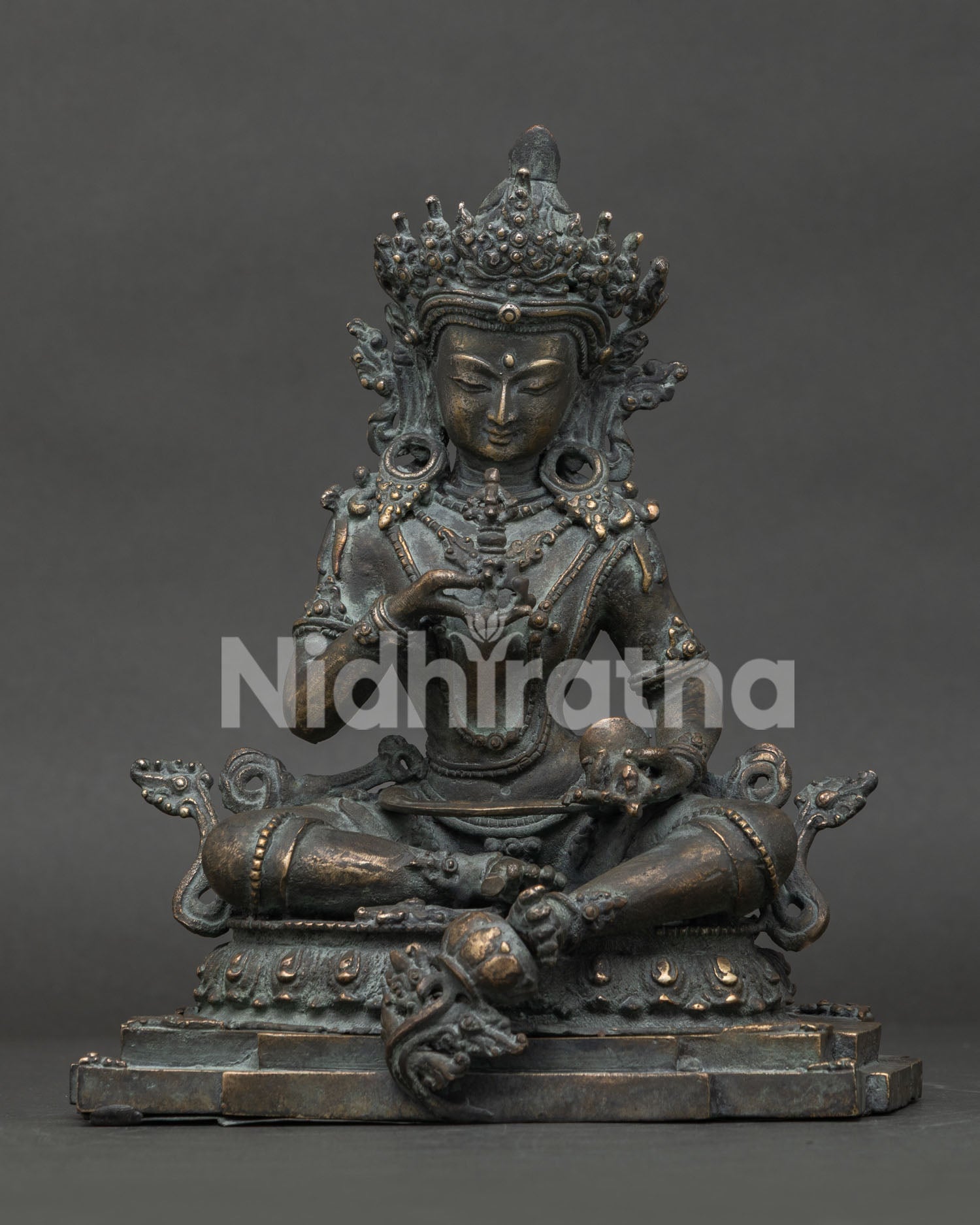 Front view of antique bronze Vajrasattva statue in Lalitasana posture on lotus pedestal, handmade in Nepal.