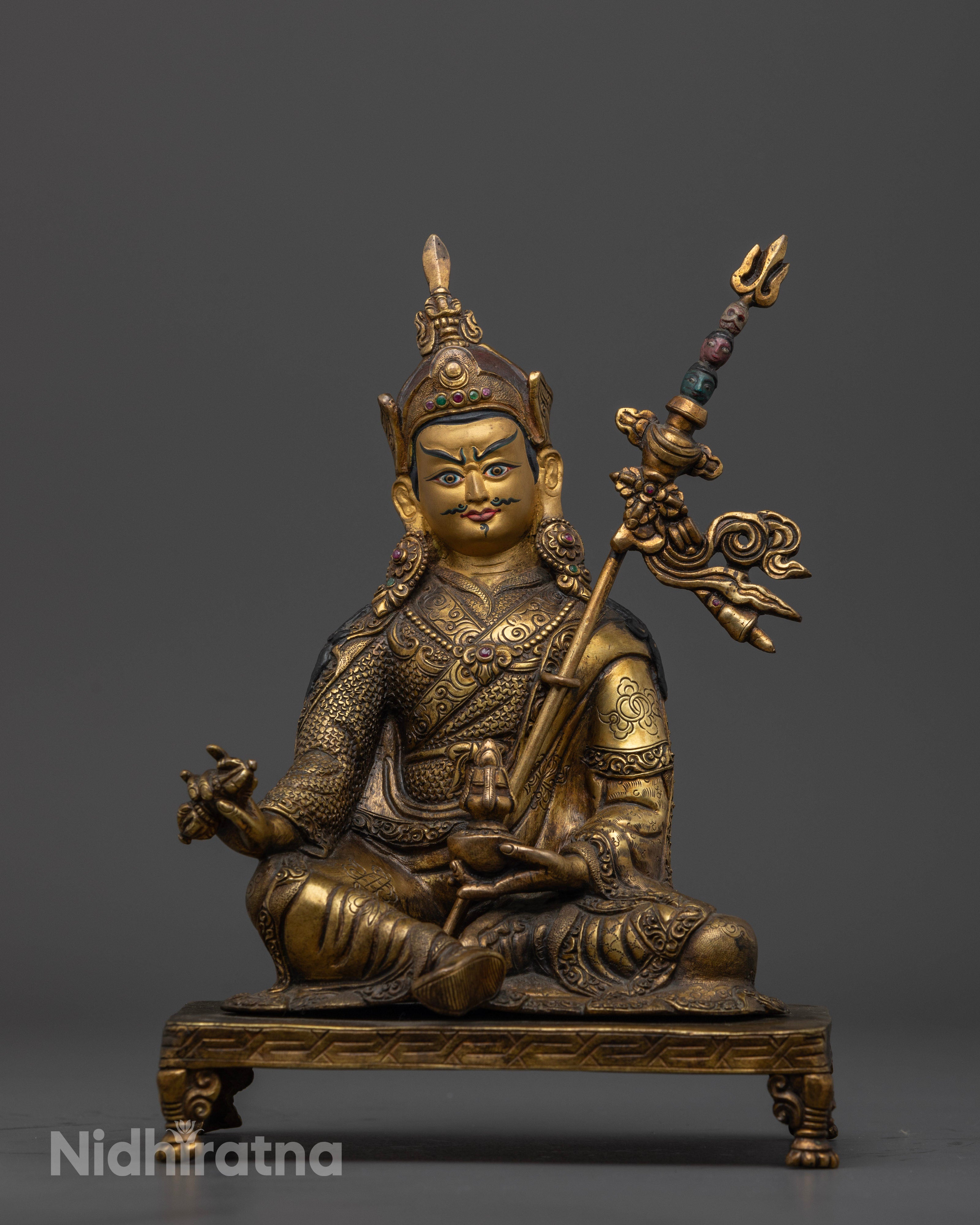 Front view of antique Guru Rinpoche statue with gold gilded finish and copper craftsmanship