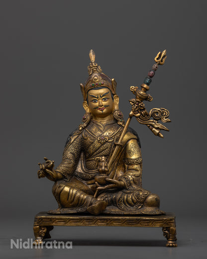 Front view of antique Guru Rinpoche statue with gold gilded finish and copper craftsmanship