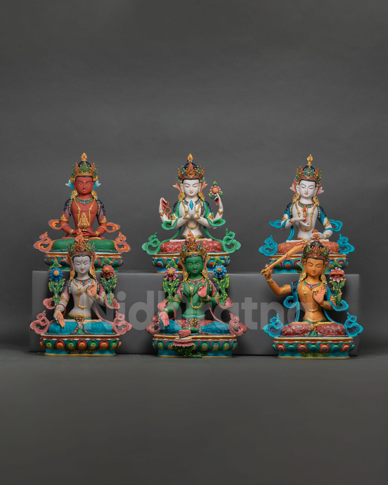 Front view of Bodhisattva statue set handcrafted in Nepal, copper with hand painted detailing for Buddhist altar decor