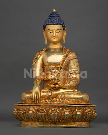 Front view of Buddha Shakyamuni statue seated in earth touching mudra on lotus base from Nepal