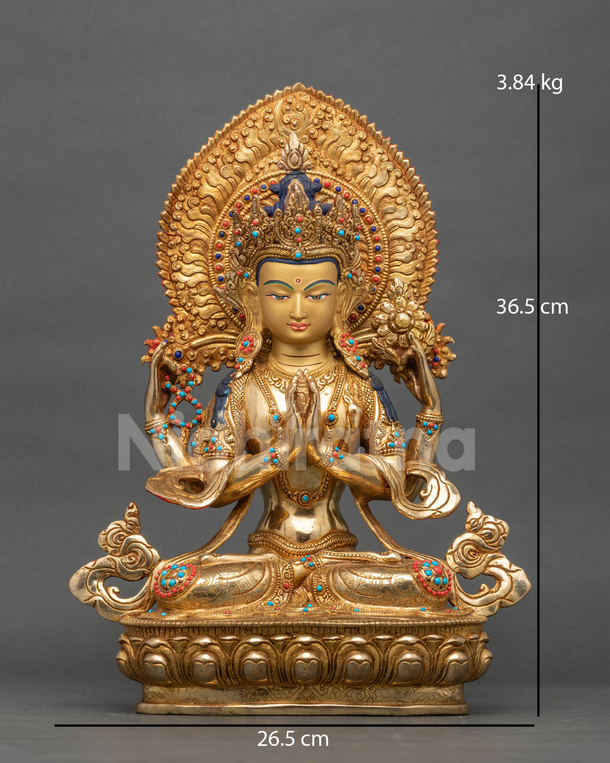 Front view of Chenrezig copper statue from Nepal, seated on lotus pedestal