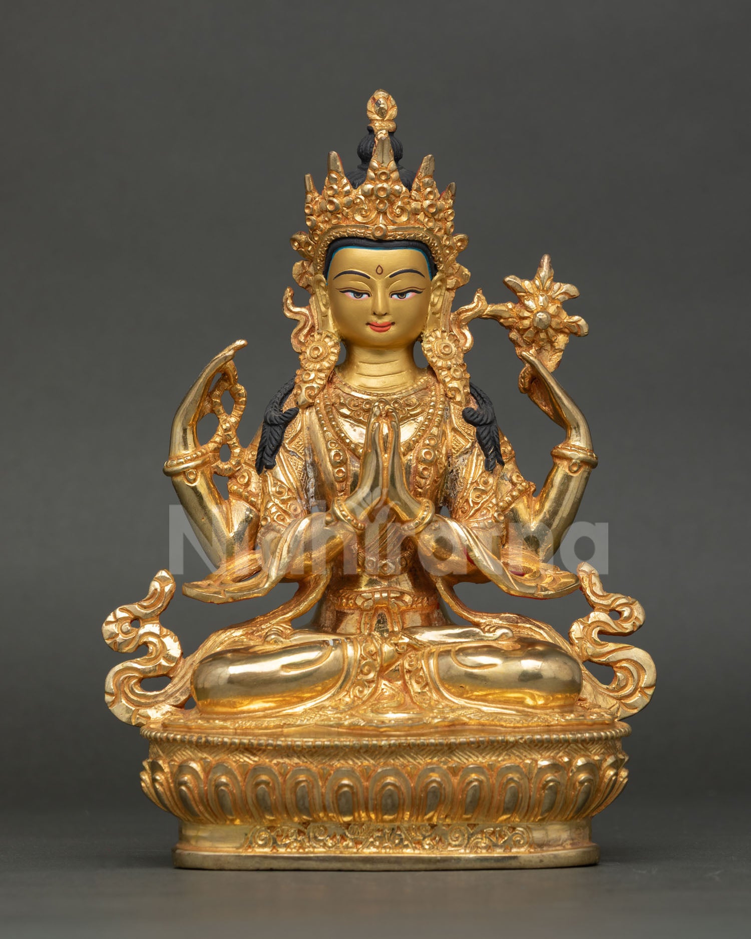 Front view of Chenrezig statue, handcrafted in copper with 24K gold detailing and a gold-painted face, symbolizing compassion and peace.