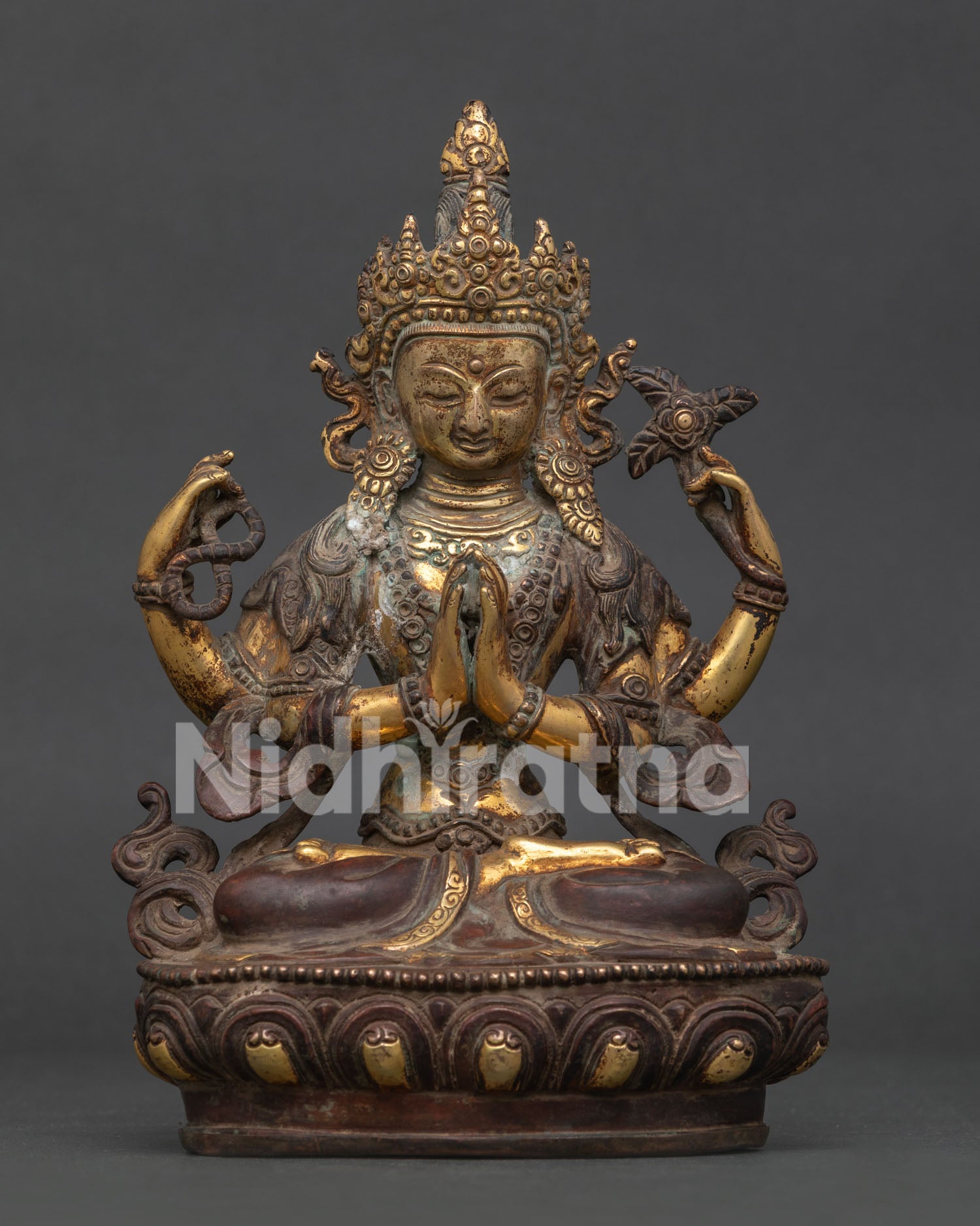 Front view of Chenrezig Statue with 24K gold fire-gilded antique oxidized finish on lotus pedestal.