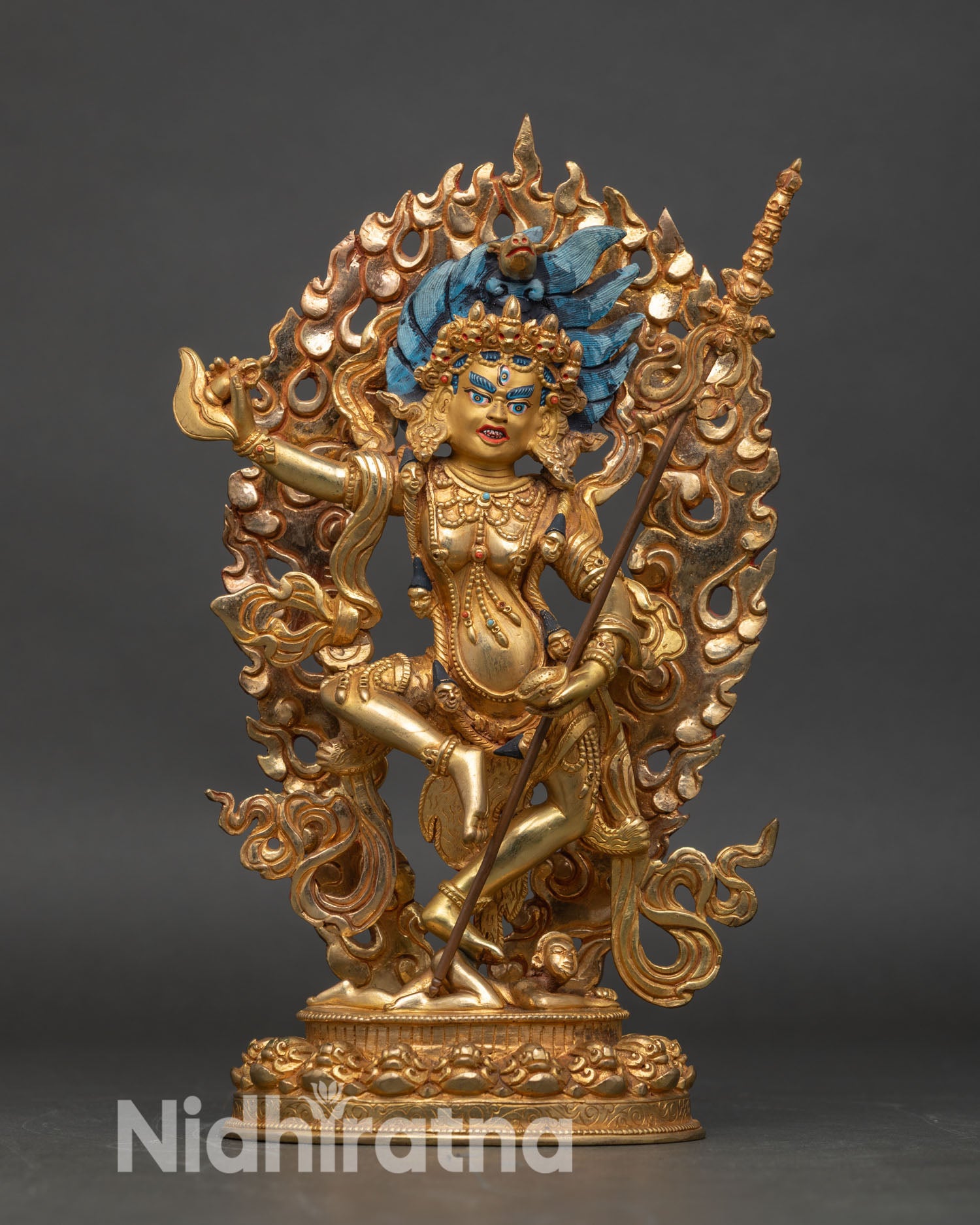 front view of Dorje Phagmo statue handcrafted copper gold painted face wrathful protector goddess adorned with semi-precious stones