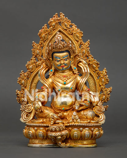 Front view of Dzambhala statue seated on lotus throne with sacred Buddhist symbolism