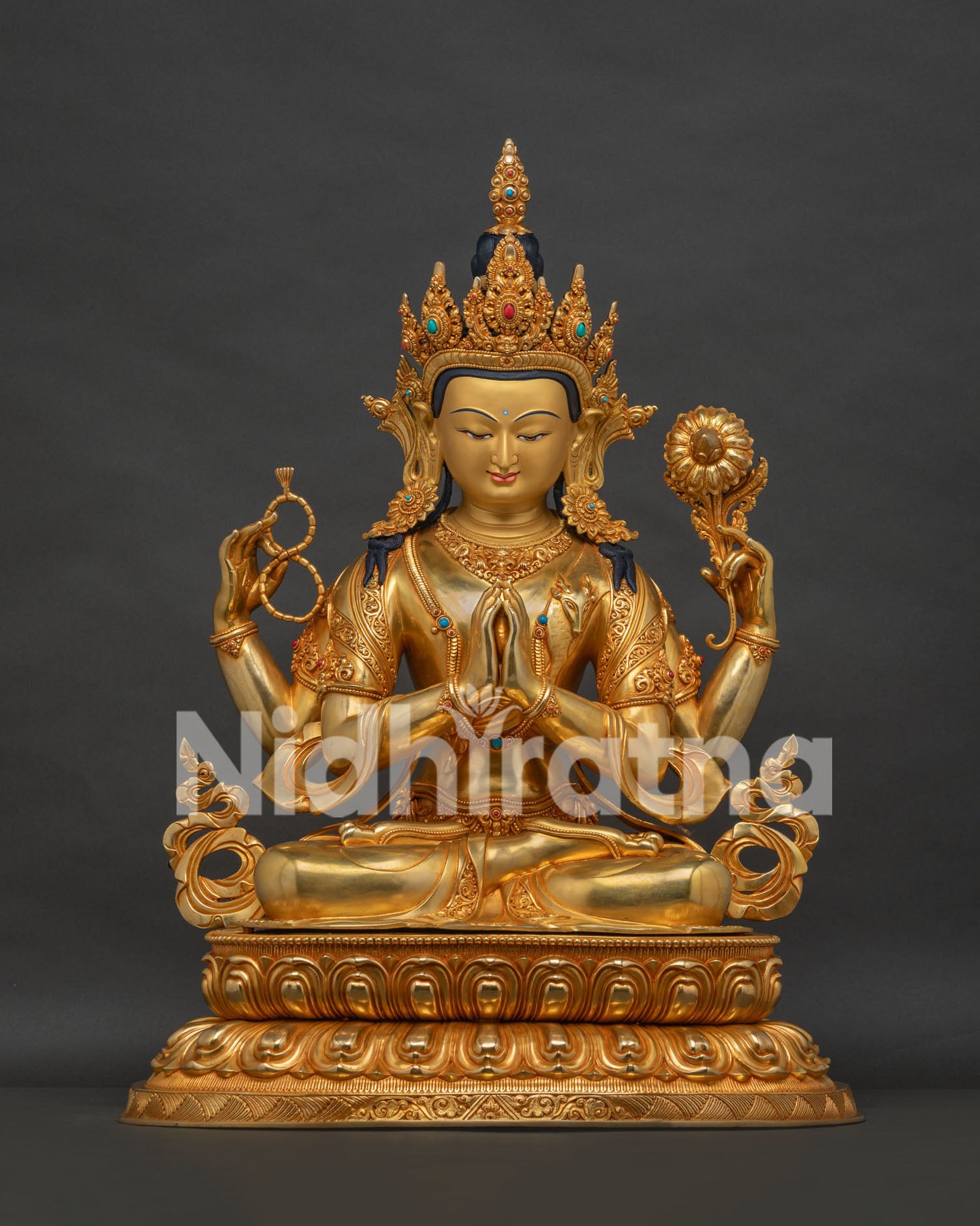 Front view of four armed Avalokiteshvara Chenrezig copper statue with 24K gold gilding from Nepal