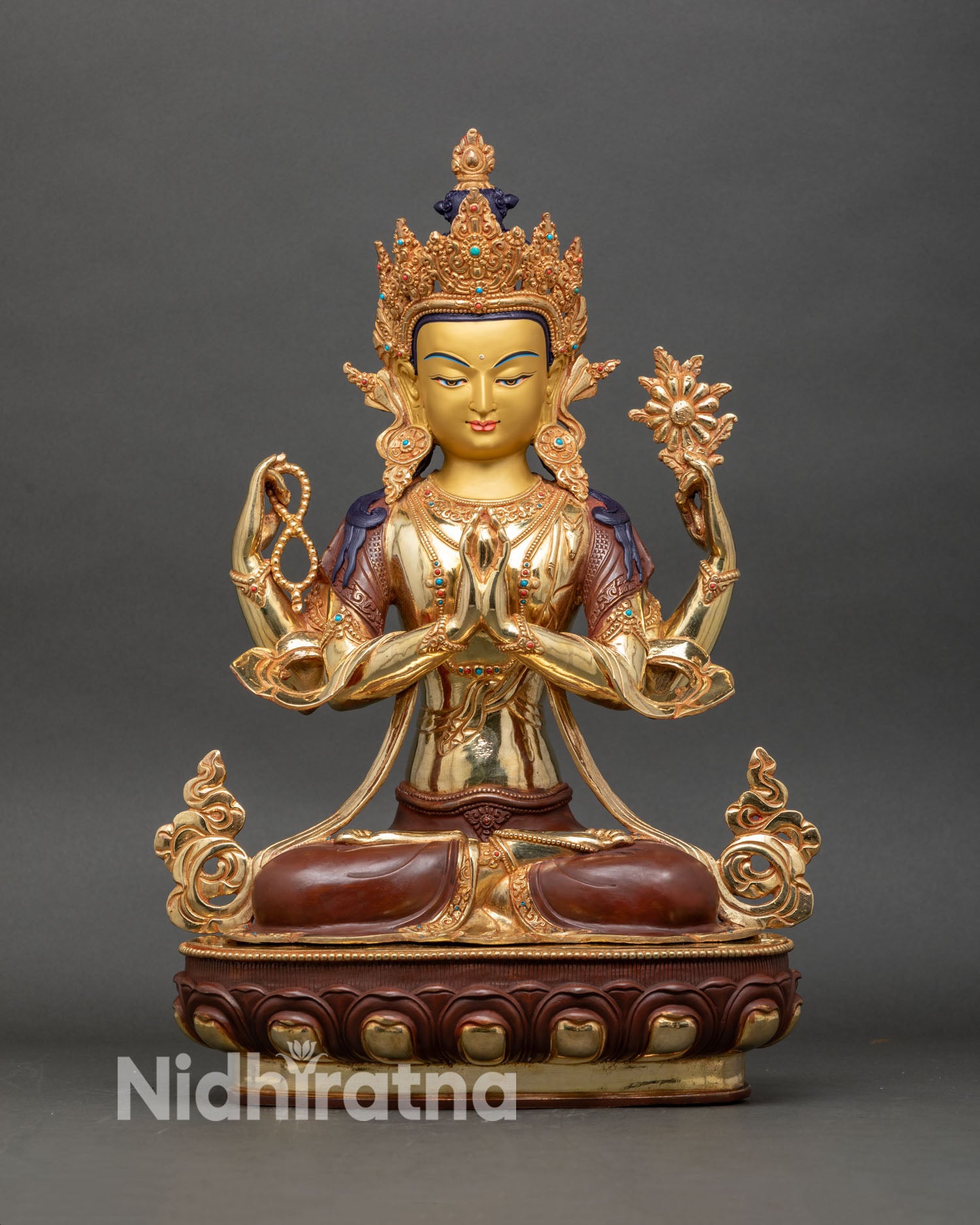 front view of four armed chenrezig statue, fire gilded copper buddhist sculpture from nepal