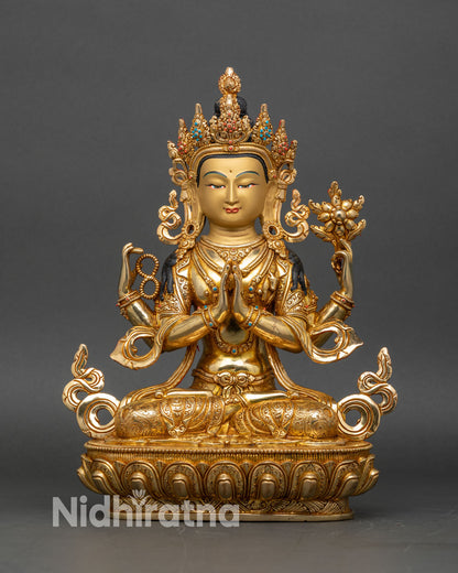 Front view of four-armed Chenrezig statue from Nepal with 24K gold gilded copper finish
